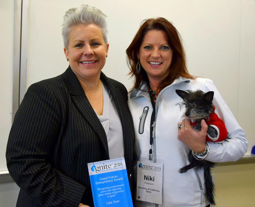 Dyer (left), founder/CEO StemExpress, received the Vulcan Award, which recognizes entrepreneurial success and supporting future student entrepreneurs at the Ignite Conference. Standing with her are the institute's senior program manager, Niki Peterson—and Tinkerbell.