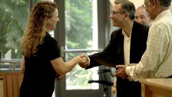 woman and man shaking hands