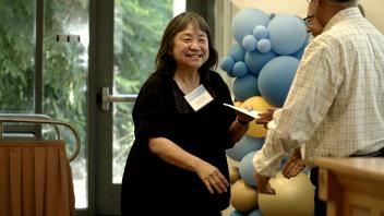 woman receiving certificate from a man