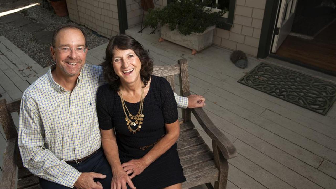 Couple sitting on an outdoor bench