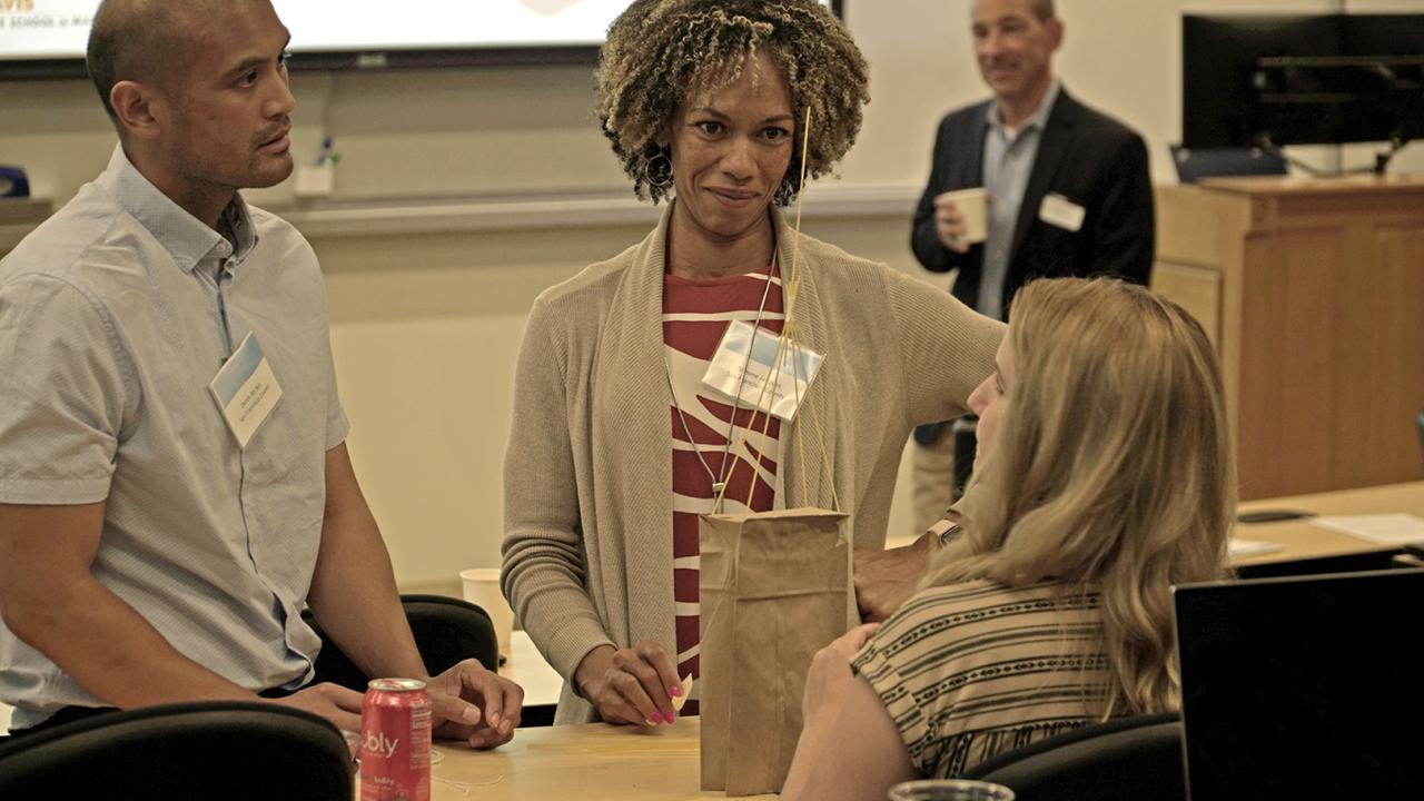 adult students engaged in an innovation exercise