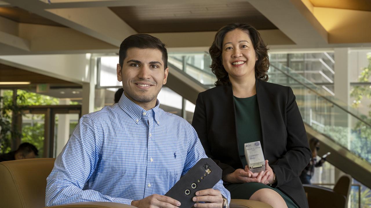 photo of two students with a prototype of their medical device innovation