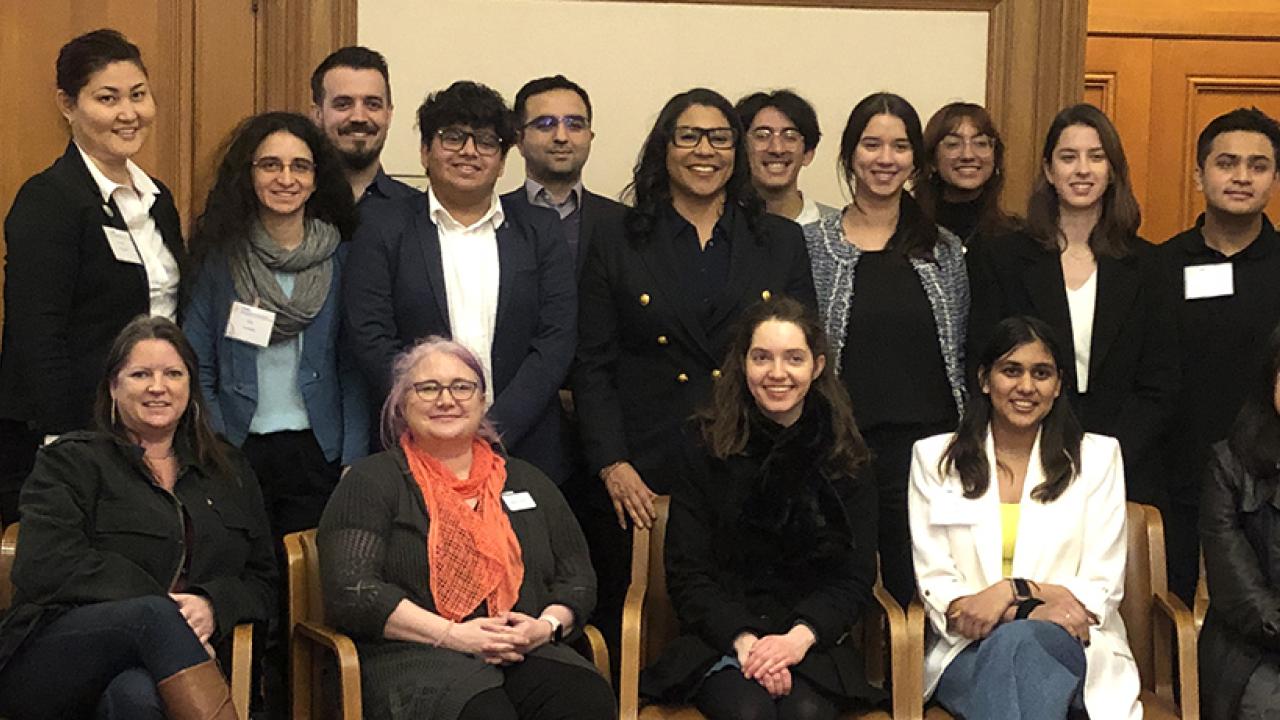 photo of a group of students and others with SF Mayor London Breed