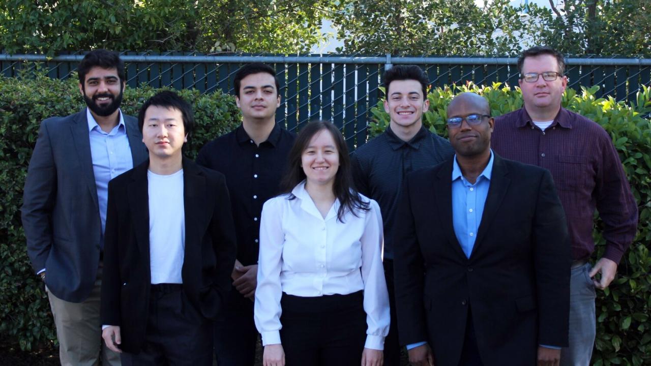 image of diverse team members standing outdoors