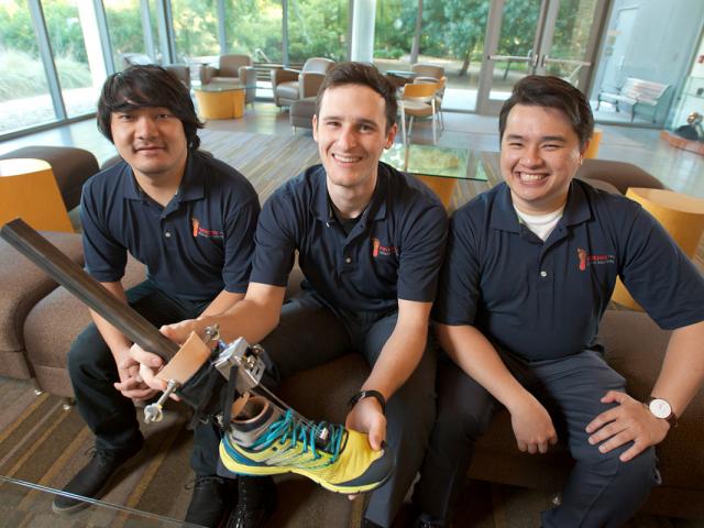 three male students with artificial leg and foot