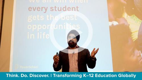 man presenting with a screened image behind him and an overlay of video play icon