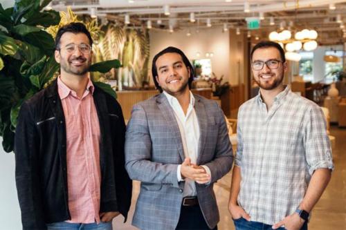 image of three men standing indoors