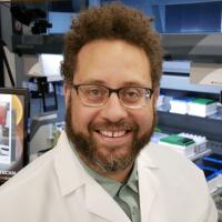 Headshot of Imani Caradonna in a lab