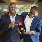 two business students with a shoe created by their startup