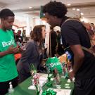 student entrepreneurs tabling with their app at Sacramento State orientation