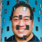 Ben Wang's headshot is projected on the NASDAQ building 