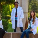 image of three female entrepreneurs wearing doctor coats sitting and standing outdoors