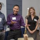 image of four people standing indoors